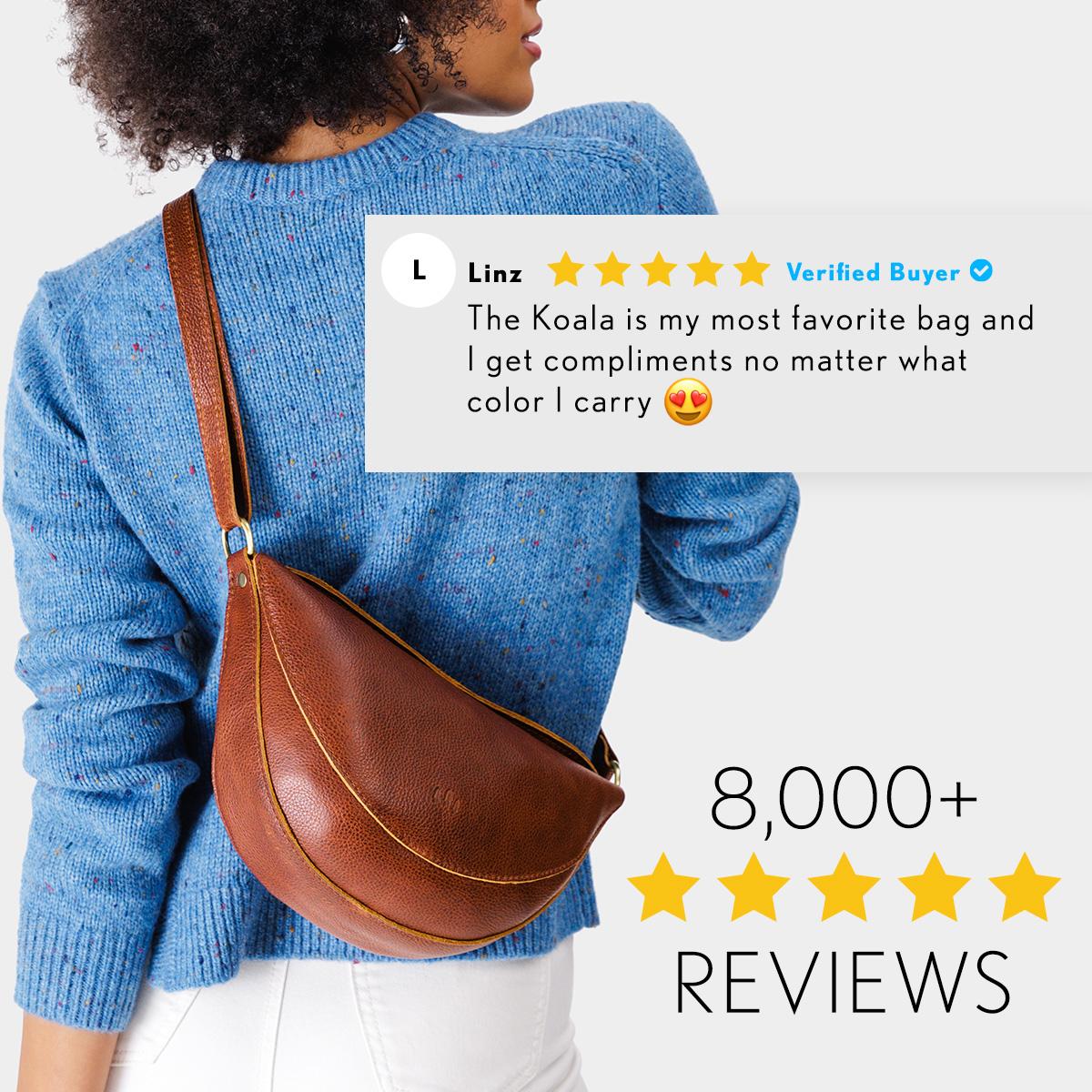 Model wearing Nutmeg Koala Sling Bag with review stating "The Koala is my most favorite bag and I get compliments no matter what color I carry" text that also states 8,000 five-star reviews
