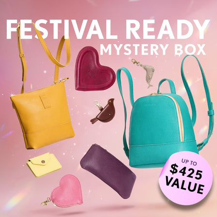 A collection of bags and small goods. Text reads "Festival Ready Mystery Box"