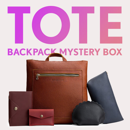 Tote Backpack in Nutmeg next to Leather Snap Journal, Mini Envelope Wallet, Marigold Pouch, and Utility Bag. Text reads "Tote Backpack Mysteyr Box"