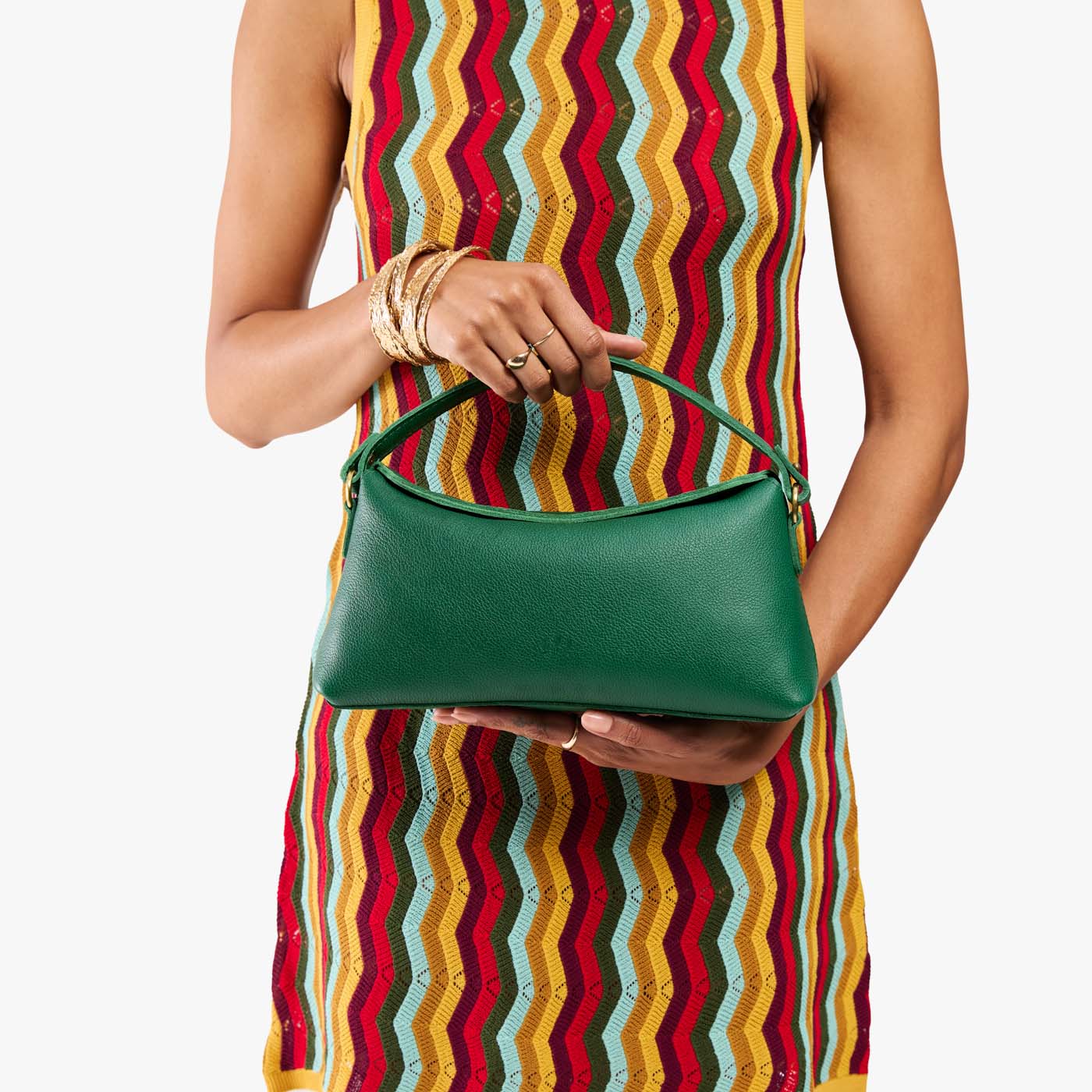 Bacalar | Model holding a green bowler style hand bag 