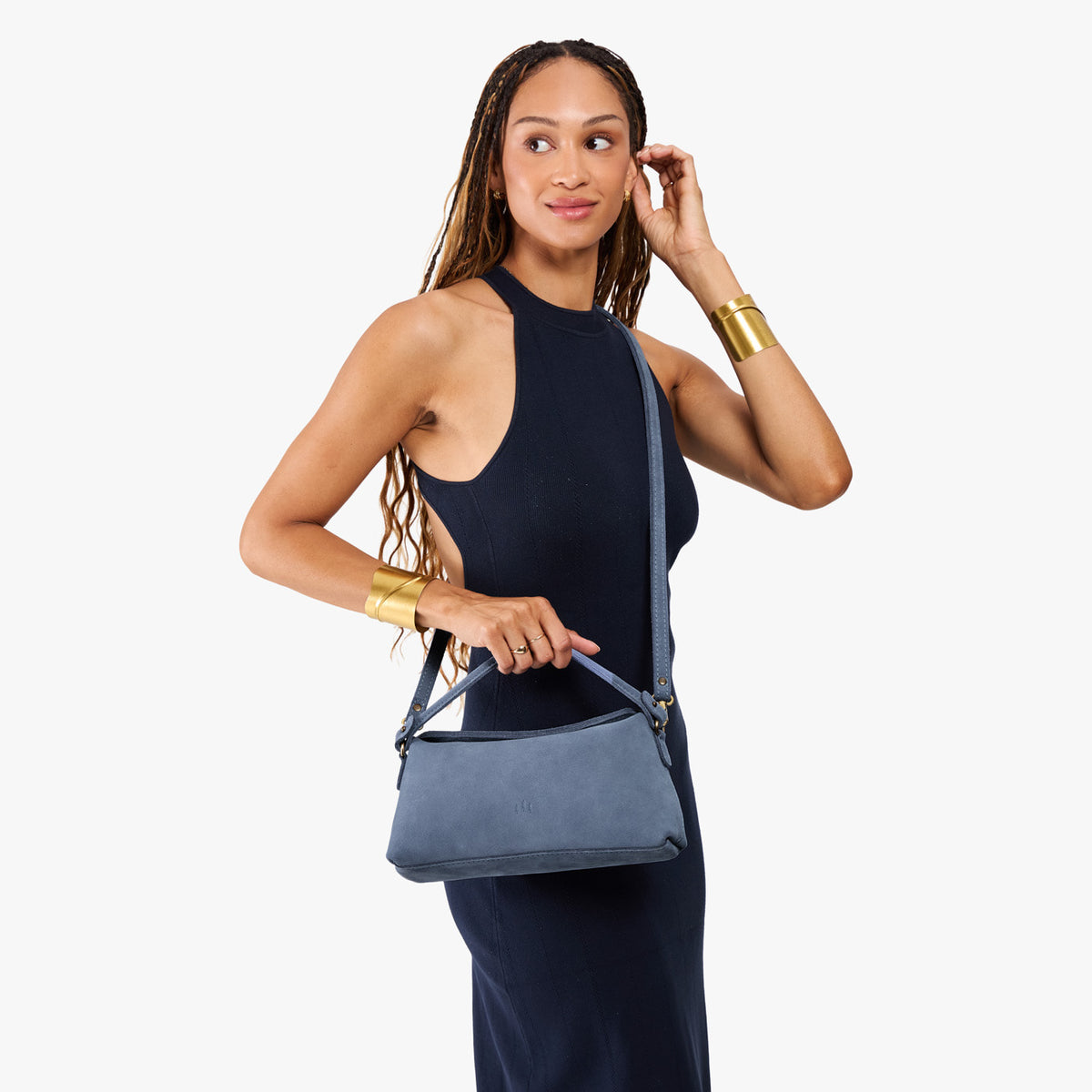 Denim | Model holding a light blue bowler style hand bag 