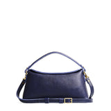 Cobalt | Leather bowler bag with magnetic closure against a white background