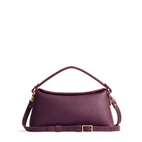 Plum | Leather bowler bag with magnetic closure against a white background