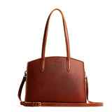 Nutmeg Large | Leather tote bag with handles, adjustable crossbody strap, zipper top, and two back pockets