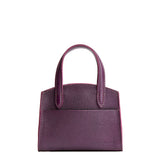 Plum Mini | Leather tote bag with handles, adjustable crossbody strap, zipper top, and a back pocket