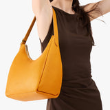 Sunshine Medium | U-shaped, flat-bottomed leather shoulder bag with adjustable strap