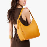 Sunshine Medium | U-shaped, flat-bottomed leather shoulder bag with adjustable strap