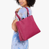 Cosmo Medium | Model carrying leather tote bag with matching leather handles