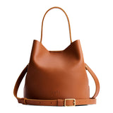 Honey Large | Symmetrical bucket bag with handle, latch closure, and removable crossbody strap