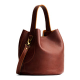 Nutmeg Large | Symmetrical bucket bag with handle, latch closure, and removable crossbody strap