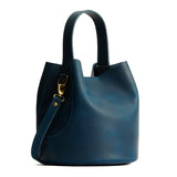 Westward Blue Large | Symmetrical bucket bag with handle, latch closure, and removable crossbody strap