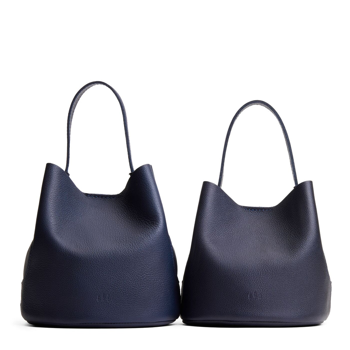 Night Owl | Size comparison image of two symmetrical leather bucket bags