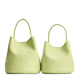 Shadow Lime | Size comparison image of two symmetrical leather bucket bags
