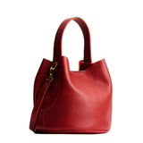 Chili Red Small | Symmetrical bucket bag with handle, latch closure, and removable crossbody strap
