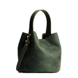 Evergreen Small | Symmetrical bucket bag with handle, latch closure, and removable crossbody strap