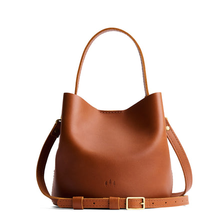 Honey*Large | Symmetrical bucket bag with handle, latch closure, and removable crossbody strap