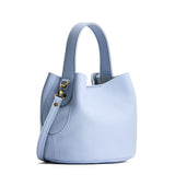 Skyway Small | Symmetrical bucket bag with handle, latch closure, and removable crossbody strap
