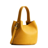 Sunshine Small | Symmetrical bucket bag with handle, latch closure, and removable crossbody strap