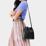 Pebbled--black Small | Model wearing slouchy crossbody bag with drawstring closure