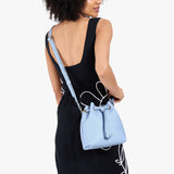 Skyway Small | Model wearing slouchy crossbody bag with drawstring closure