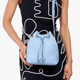 Skyway Small | Model wearing slouchy crossbody bag with drawstring closure