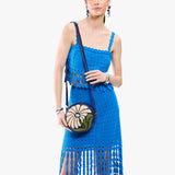 Wildflower Cobalt Small | Model wearing circle shaped crossbody bag with top zipper