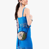 Wildflower Cobalt Small | Model wearing circle shaped crossbody bag with top zipper
