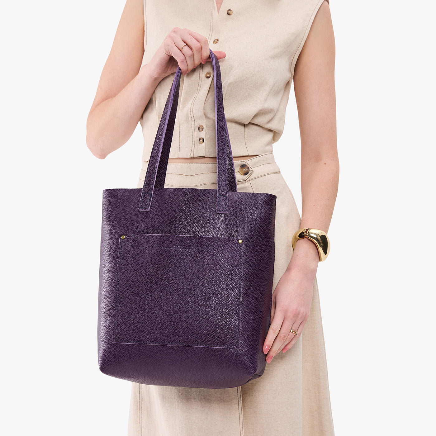 Empire*Classic | Model holding medium Tote with dual shoulder straps and crossbody strap