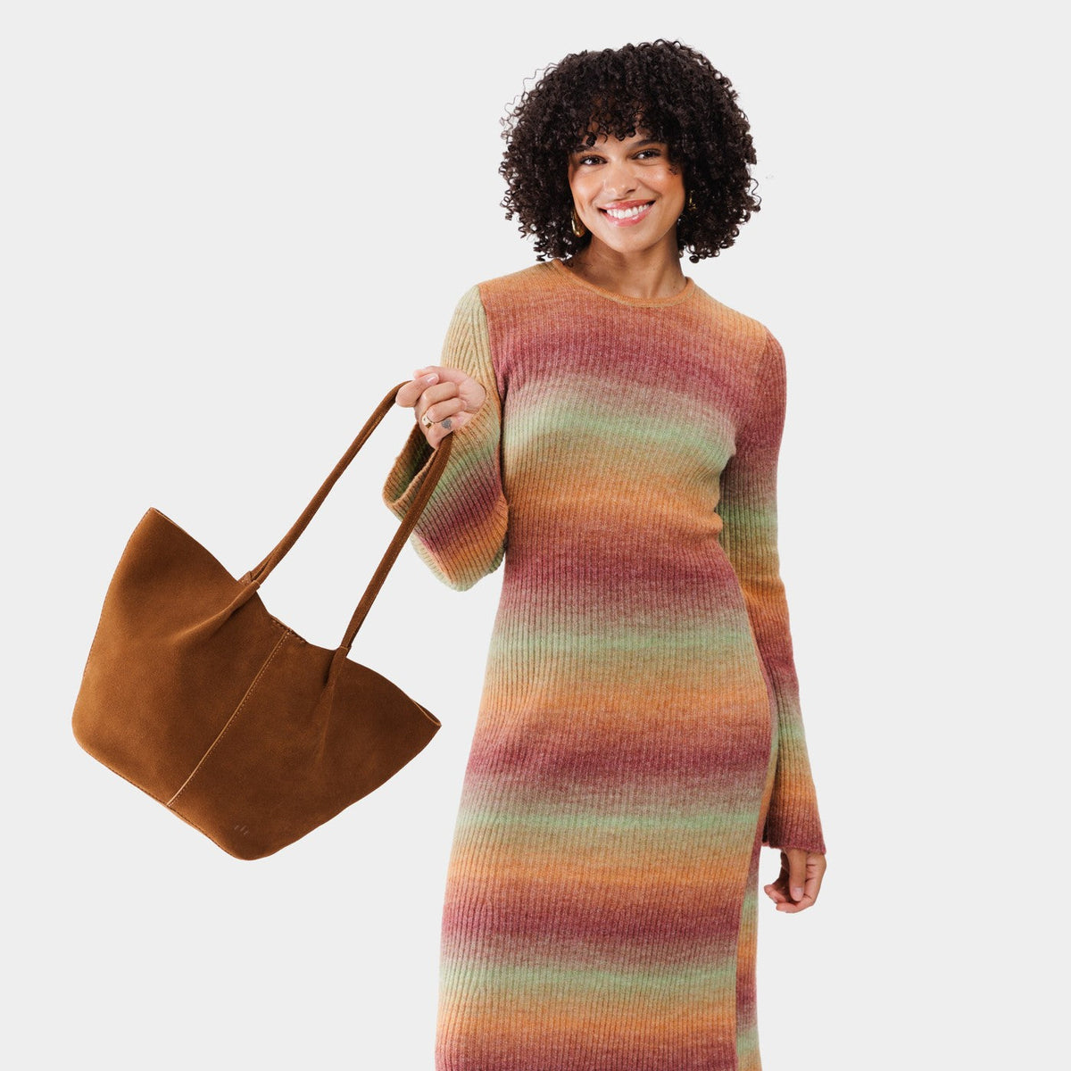 Jackson*Large | Model holding wide bucket shaped tote bag with matching leather handles
