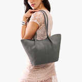 Smoke Grey Large | Model holding wide bucket shaped tote bag with matching leather handles