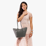 Smoke Grey Large | Model holding wide bucket shaped tote bag with matching leather handles