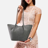 Smoke Grey Large | Model holding a  leather tote bag 