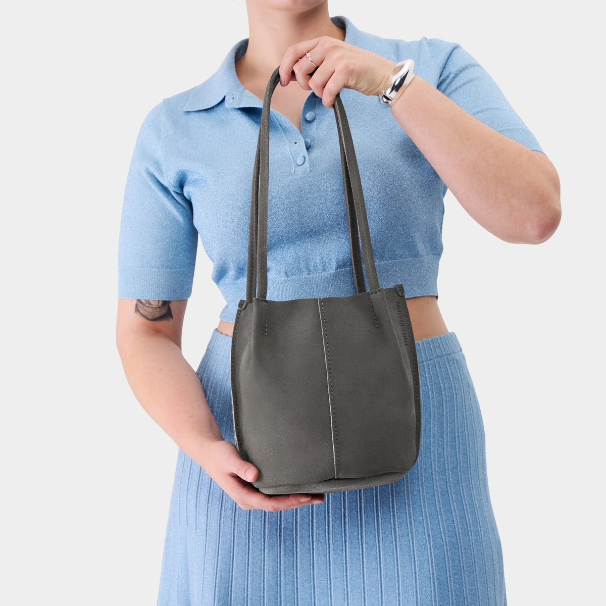 Smoke Grey*Classic | Model holding a  leather tote bag 
