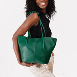 Bacalar Large | Model holding a  leather tote bag 
