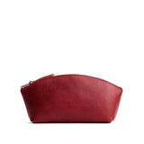 Chili Red Eclipse | Spacious leather makeup bag with curved seams and top zipper