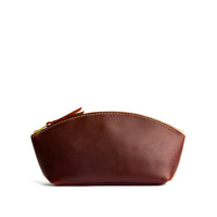 Cognac*Eclipse | Spacious leather makeup bag with curved seams and top zipper