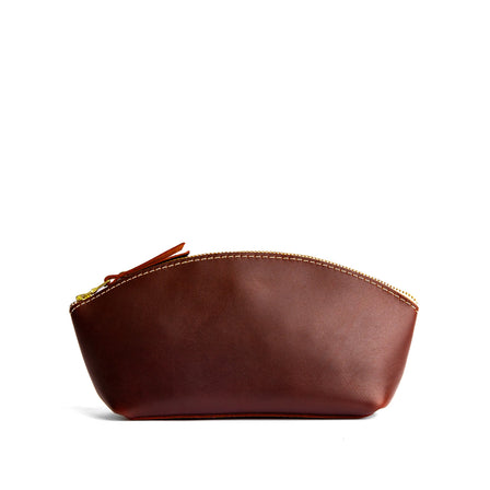 Cognac*Eclipse | Spacious leather makeup bag with curved seams and top zipper