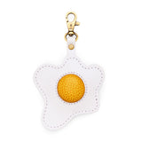 Egg | Keychain shaped like a fried egg with a swivel lobster clasp on a white background