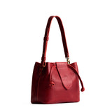 Chili Red Small | Symmetrical leather bag with leather drawstring closure and adjustable shoulder strap