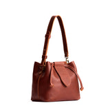 Nutmeg Small | Symmetrical leather bag with leather drawstring closure and adjustable shoulder strap