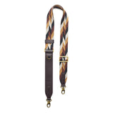 Golden Dusk | Patterned fabric and leather strap on a white background