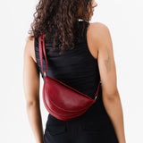 Chili Red Small | Model wearing petite half circle shaped sling bag