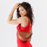 Meadow Small | Model wearing small half-moon sling bag on shoulder