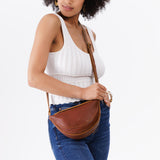 Nutmeg Small | Model wearing petite half circle shaped sling bag