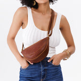 Nutmeg Small | Model wearing petite half circle shaped sling bag