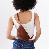 Nutmeg Small | Model wearing petite half circle shaped sling bag
