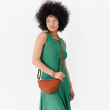 Honey Small | Model wearing petite half circle shaped sling bag