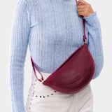 Orchid Small | Model wearing half circle shaped sling bag