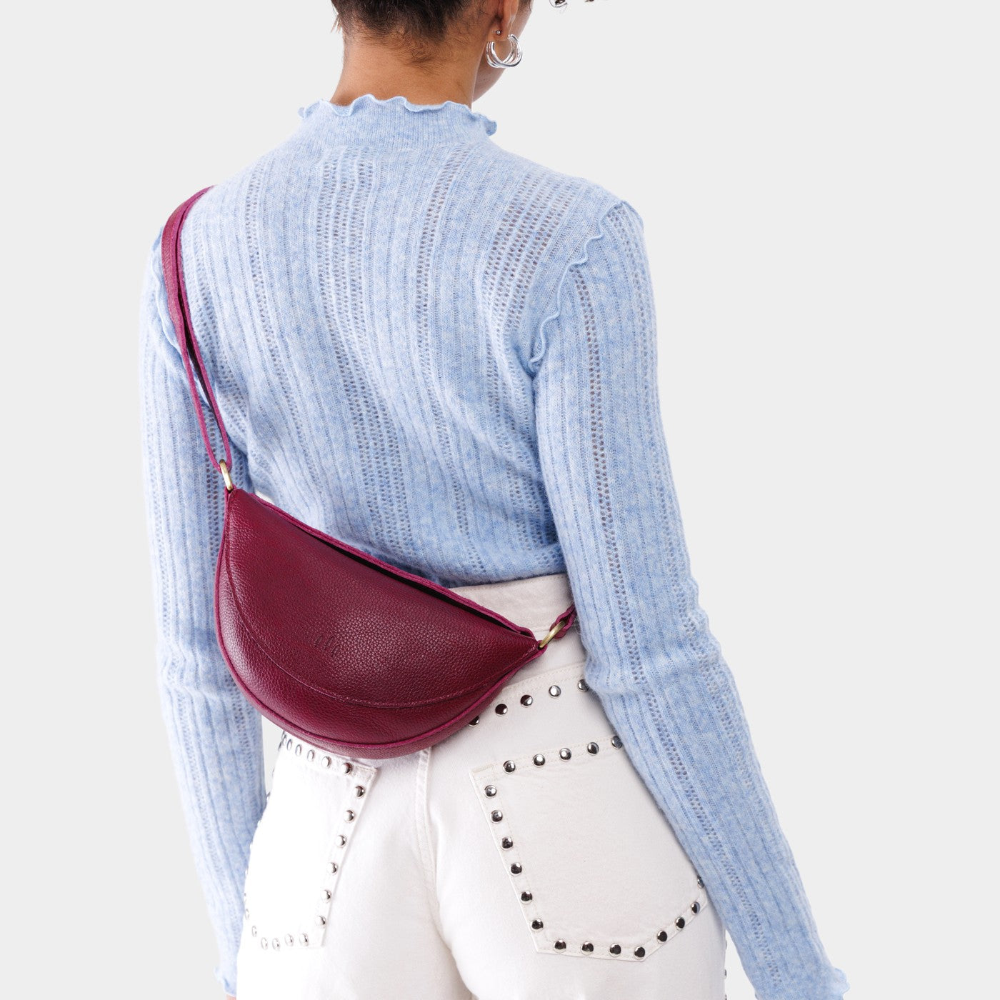 Half circle shaped sling bag