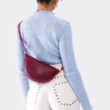 Half circle shaped sling bag